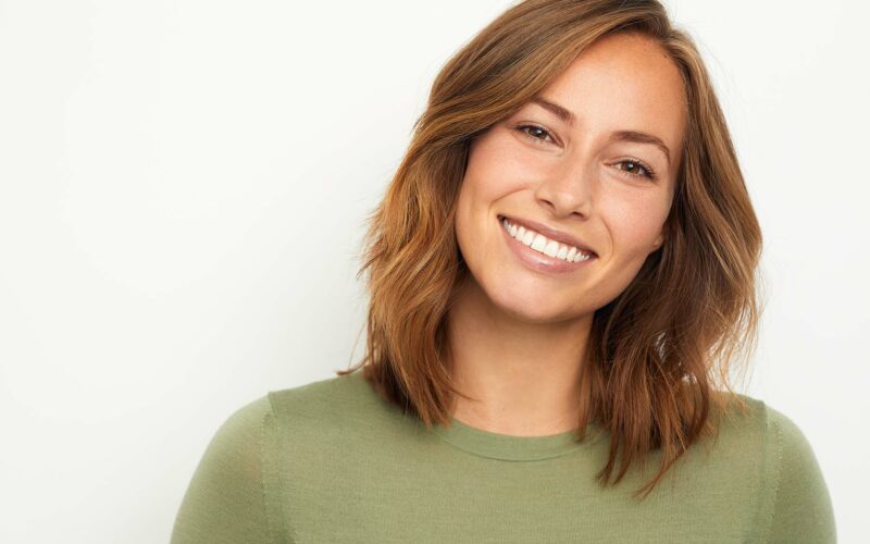 girl with healthy smile thanks to vitamins for healthy smile